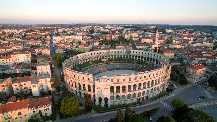 Pula Arena and old town by the sea